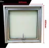 Bathroom windows: Natural anodised aluminium top-hung, frosted glass
